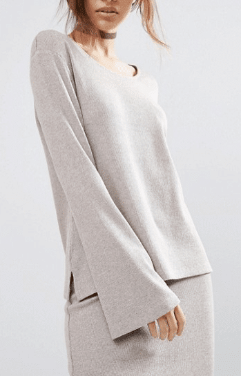Neutral colored, long sleeved, flared tunic