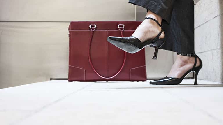 Close up of woman's feet with designer shoes