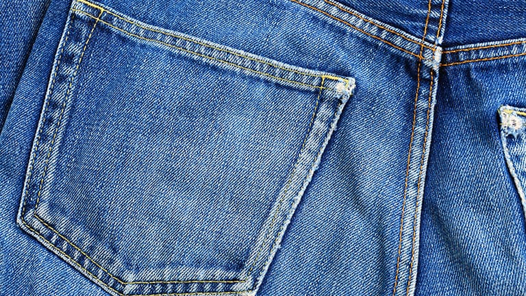 Close up of denim jeans' back pocket.