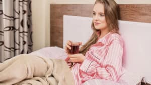 Woman wearing pajamas in bed
