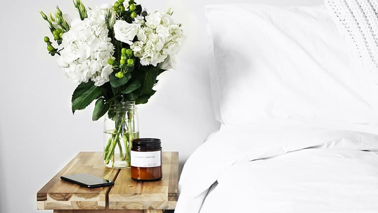 Makeshift side table in a bedroom.