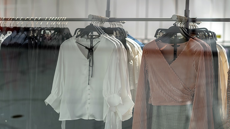 Clothes on rack to represent how to shop Walmart.