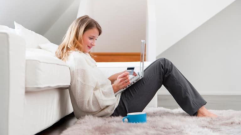 How to Shop Neiman Marcus 1 Woman shopping online.