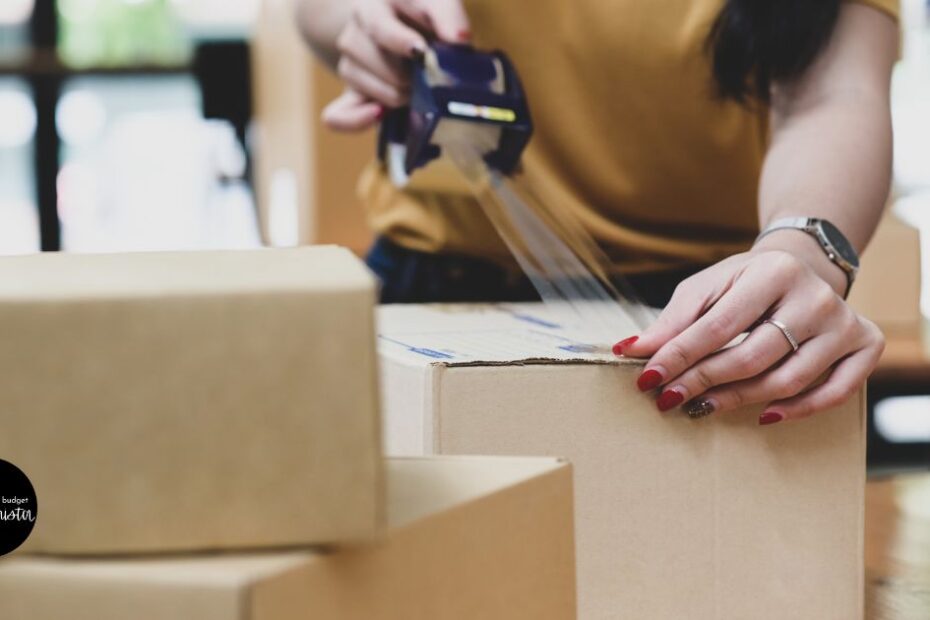 woman tapes closed shipping box