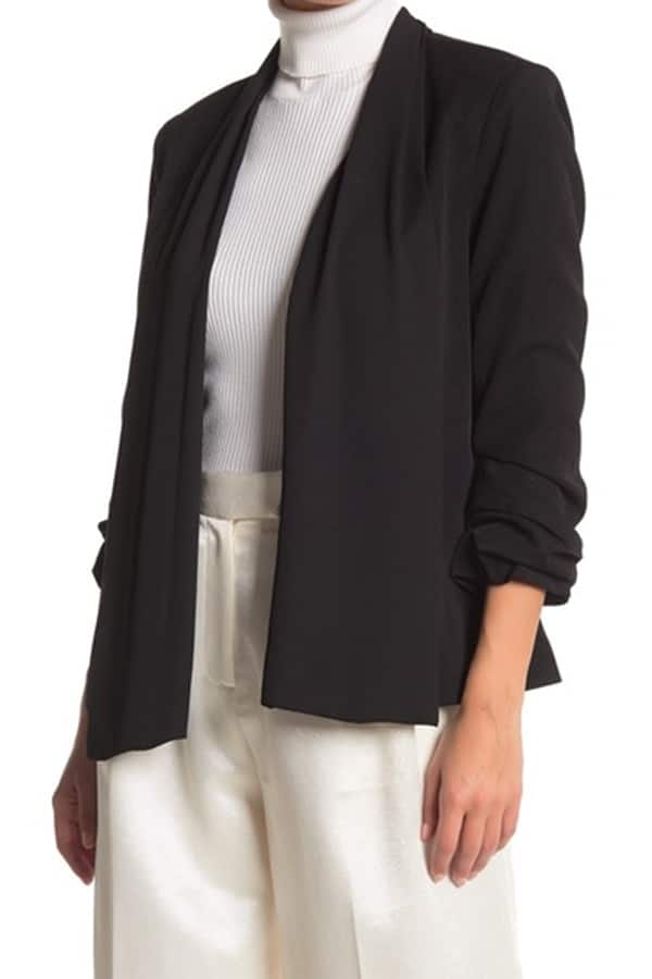 Women's tuxedo jacket — wear one for edgy holiday party looks 1 Woman wearing black tuxedo jacket