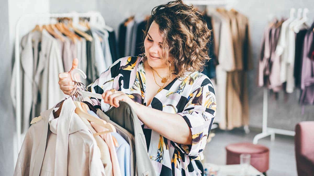 Plus size woman shops in store.