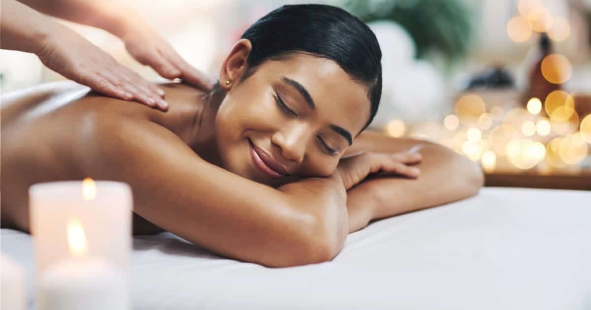 Woman getting massage after finding discount on group buying site.