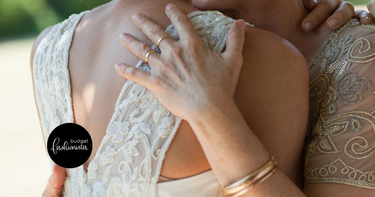Close-up view of mother-of-the-bride hugging daughter. This image is part of an original post published on Budget Fashionista.