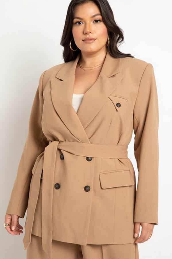 Fall Fashion for Plus Size Fashionistas: 9 Essential Garments to Shop Now 9 Model wears tan plus-size blazer, an essential fall fashion.