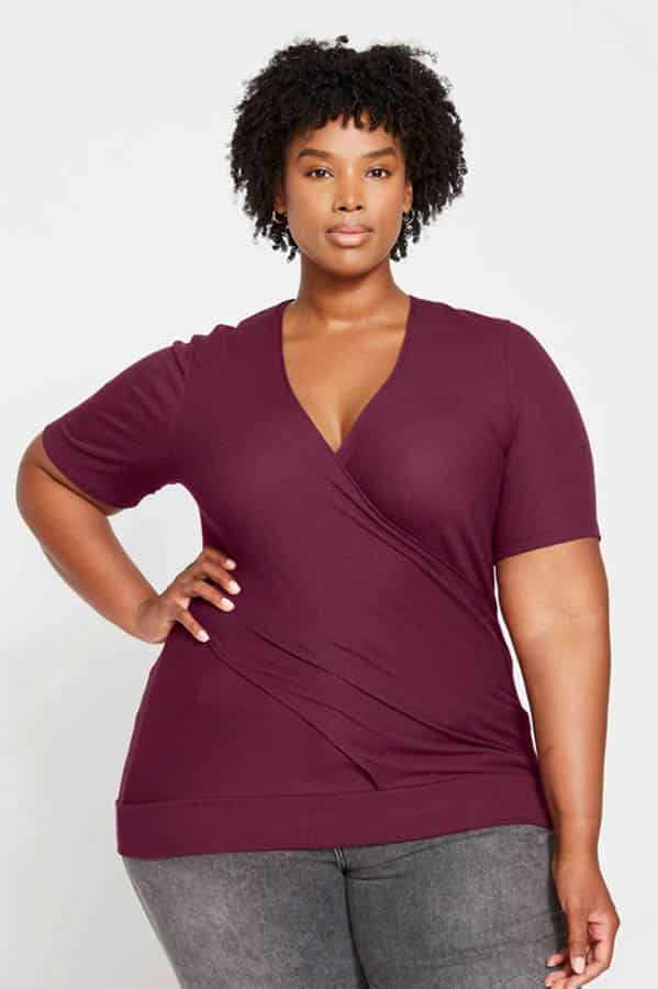 Fall Fashion for Plus Size Fashionistas: 9 Essential Garments to Shop Now 4 Plus-sized model wears ribbed wrap top.