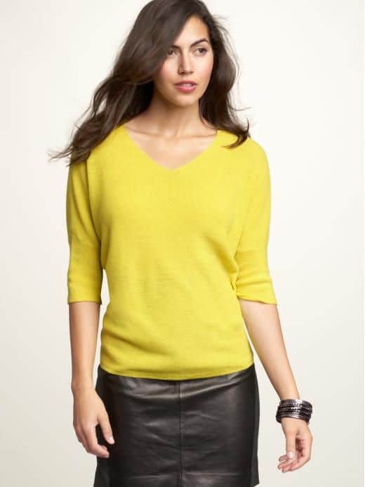 yellow shirt and white pants