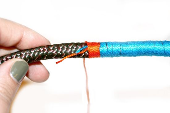 Wrapping thread around rope to make necklace