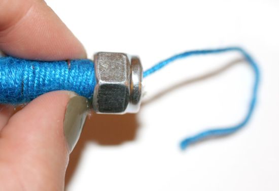 Nut attached to the end of the thread-wrapped rope
