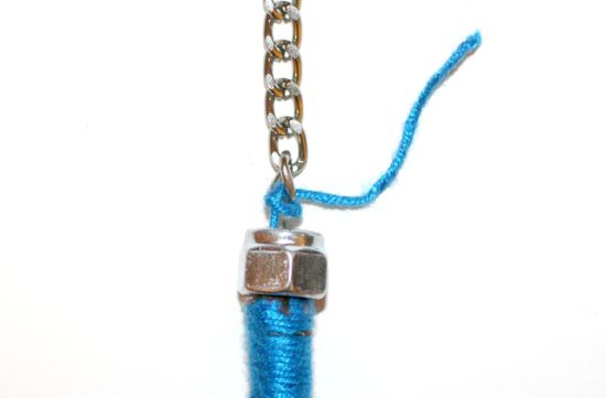 Chain tied to a thread-wrapped rope