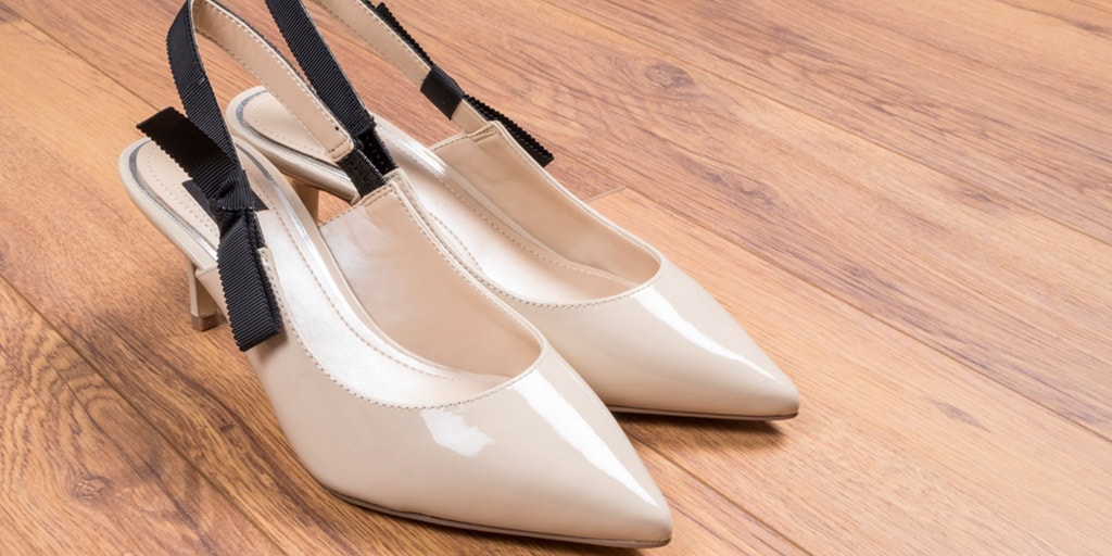 Pair of kitten heels on wood floor