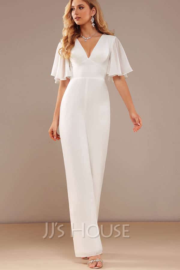 Model wears white formal jumpsuit.