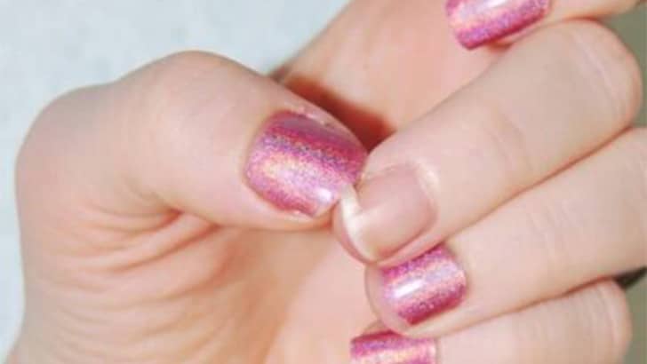 Close up view of a broken fingernail.