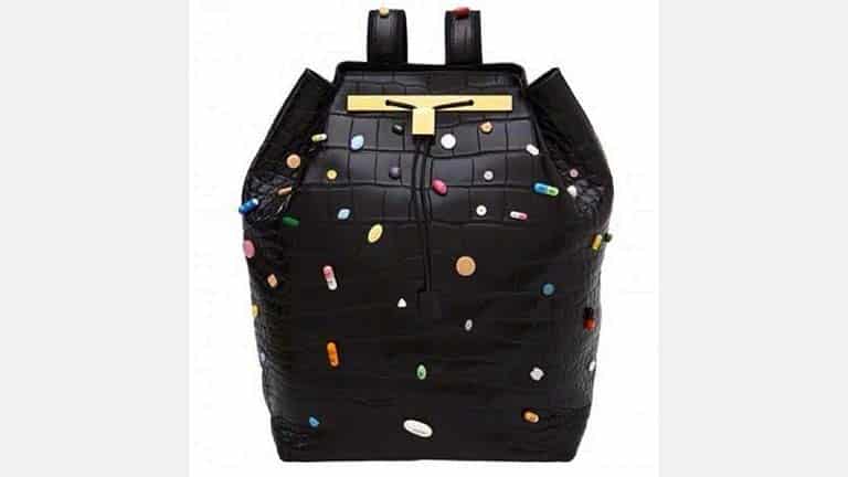Black bag adorned with prescription pills, known as the Olsen twins' pill purse.