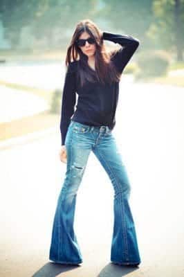 Woman wearing flared jeans