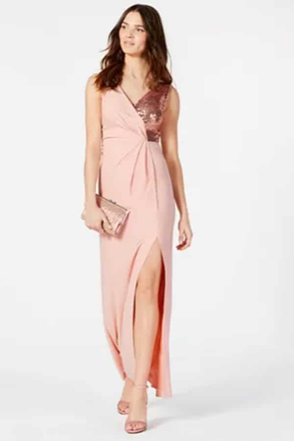 Woman wearing pink sparkly gown.