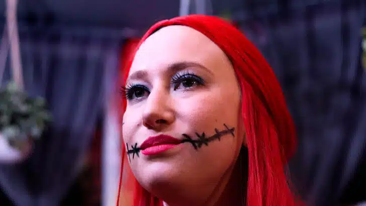 Woman wearing Halloween makeup.