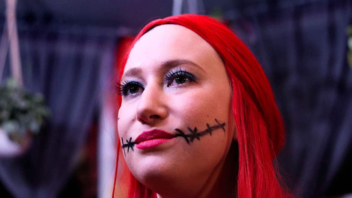 Woman wearing Halloween makeup.