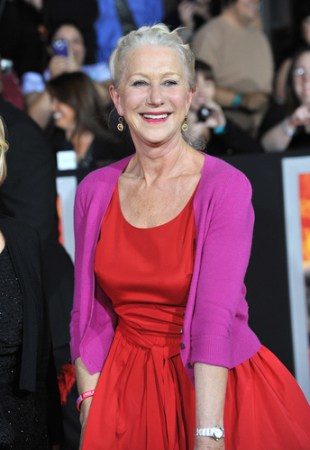 Helen Mirren wearing red dress and pink cardigan