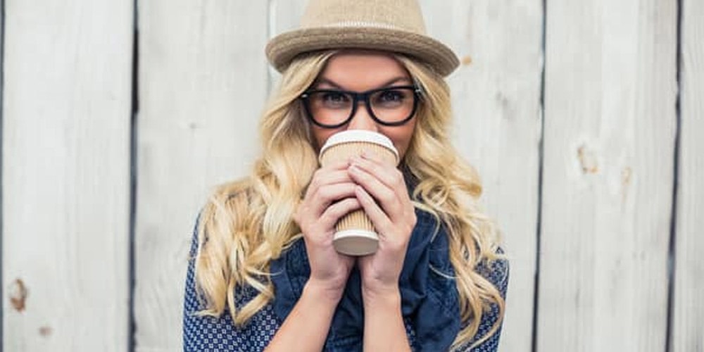 Hipster girl wearing glasses and hat
