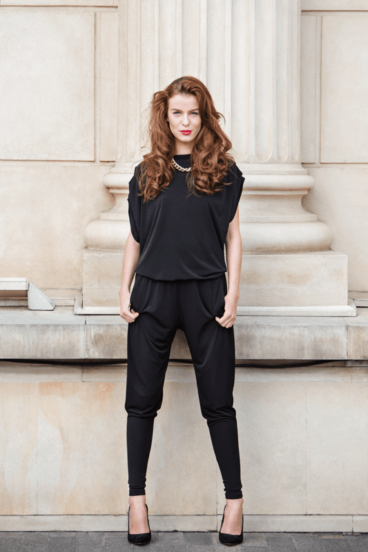 red-head wearing a black romper