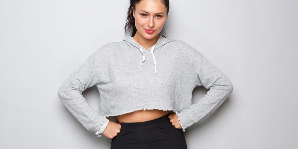 Woman wearing cropped sweatshirt