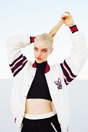 Girl wearing bomber jacket and workout tank