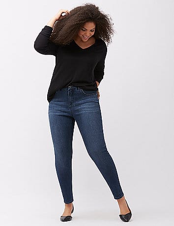 Woman wearing Melissa McCarthy Seven7 jeans with black sweater.