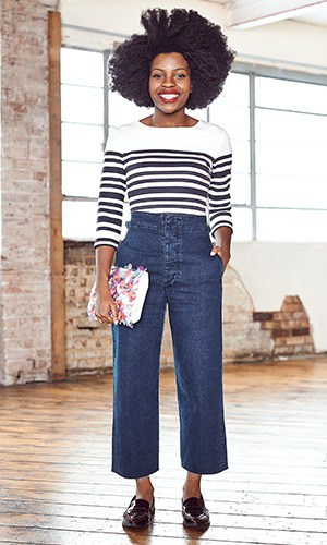 Woman wearing flared jeans and striped sweater