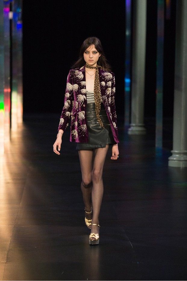 Runway model wearing leopard print skinny scarf