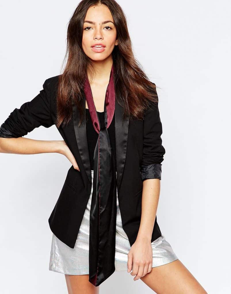Model wearing blazer and skinny scarf