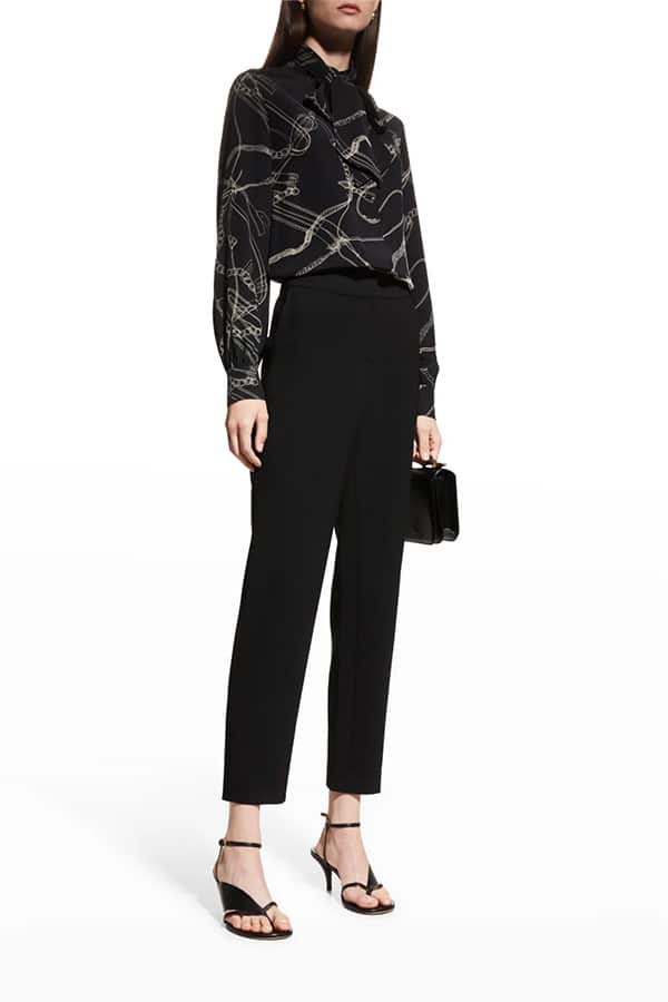 Model wearing equestrian printed blouse.