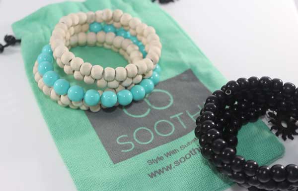 beaded bracelets on green background