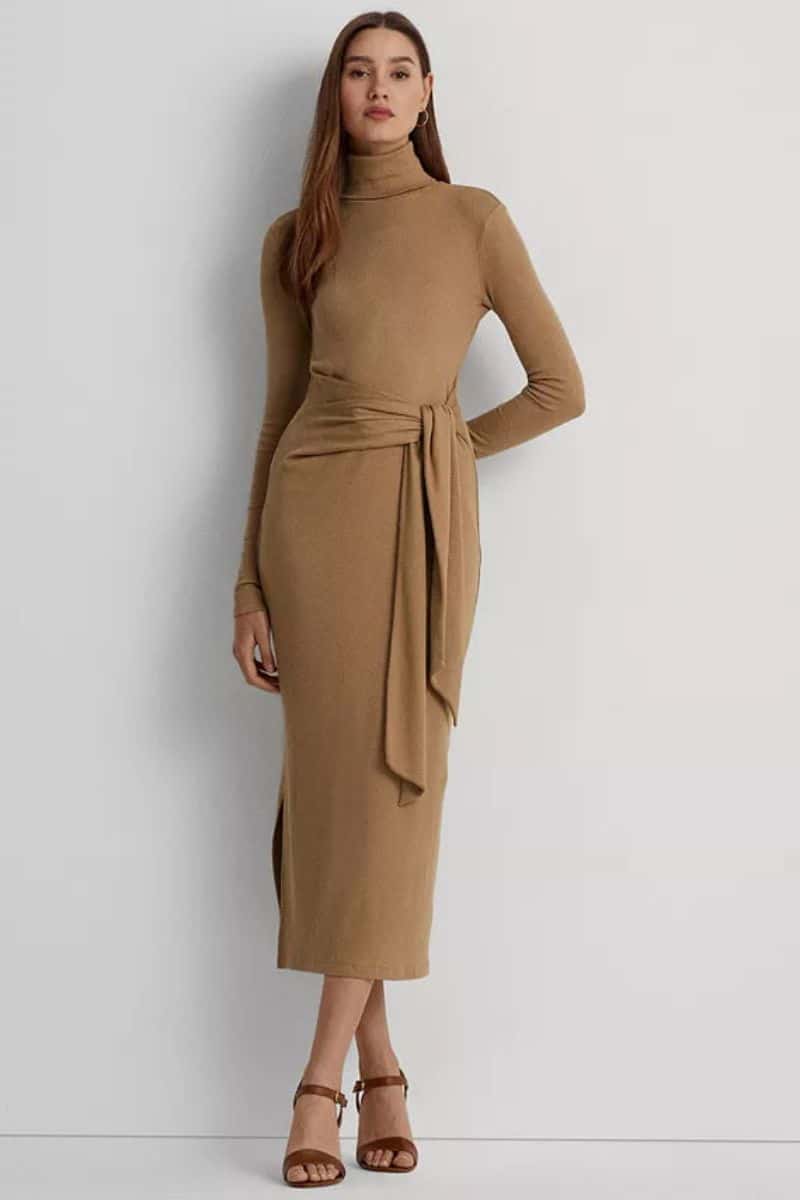 Model wears belted midi sweater dress.