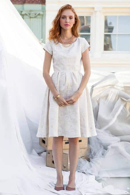 holiday outfits - woman wearing white cocktail dress