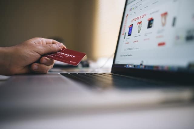 Dealspotr Review: Bargain Shopper's Dream or Just Another Coupon Site? 1 someone shopping online with credit card