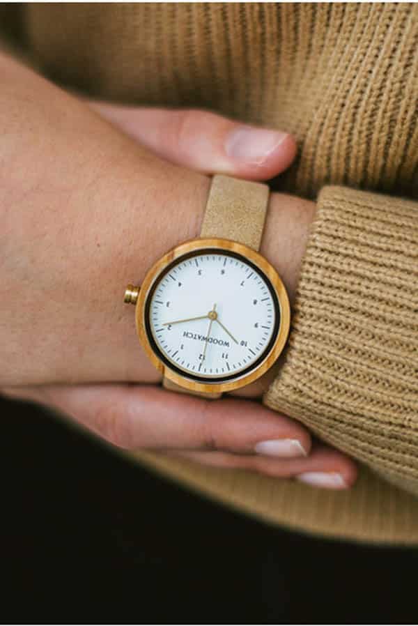 Give Good: 9 Charity Gifts Fashion Enthusiasts will Love 6 Close up of woman's arm wearing watch from charity brand Woodwatch.