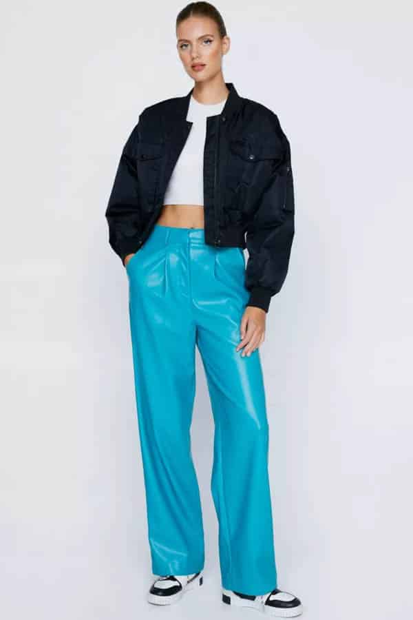 Model wears blue faux leather pants from online store Nastygal.