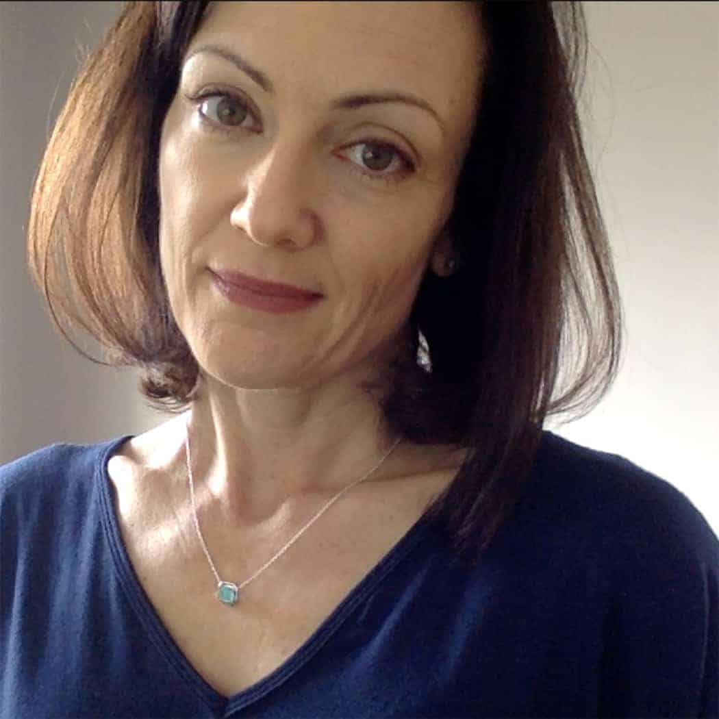Catherine Brock of Budget Fashionista wearing Ippolita turquoise pendant necklace