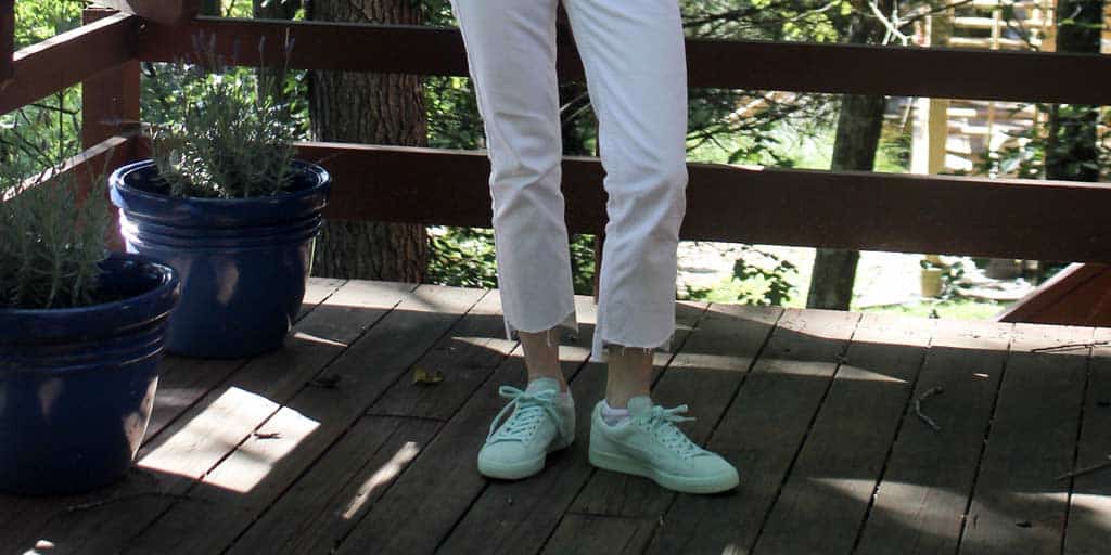 close-up of my DIY step hem white jeans