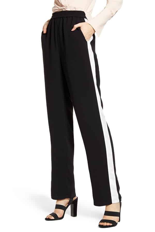 Black track pants with white side-stripe 