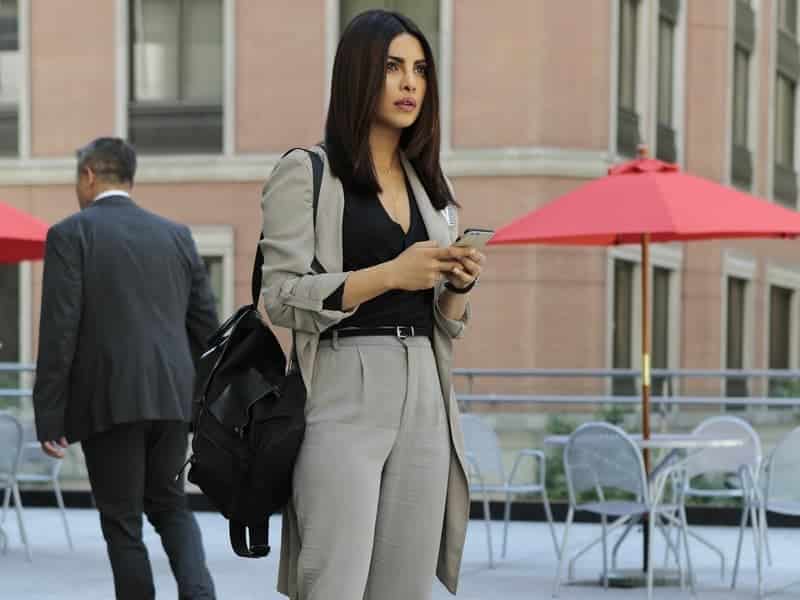 Quantico star showing offer her fashion sense in a power suit