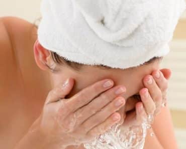 Woman washing her face