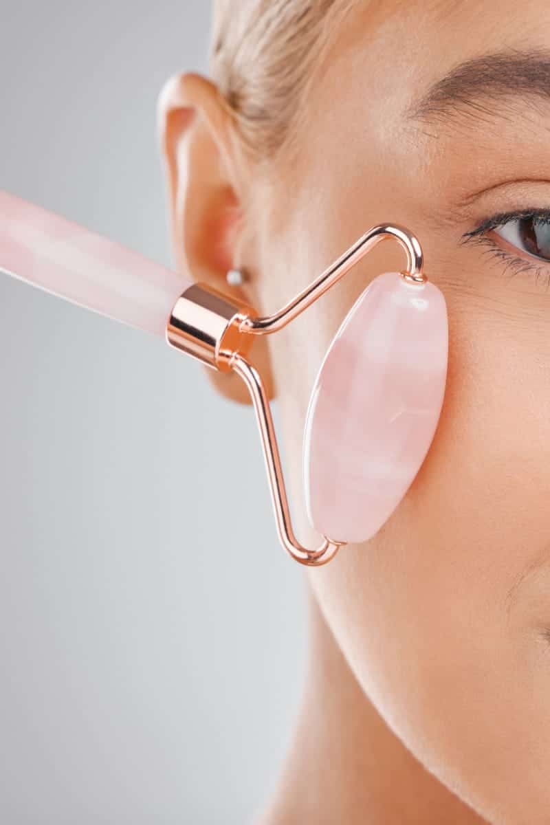 These are the Best-Selling Beauty Rollers on Amazon 1 Close up of woman using beauty roller.