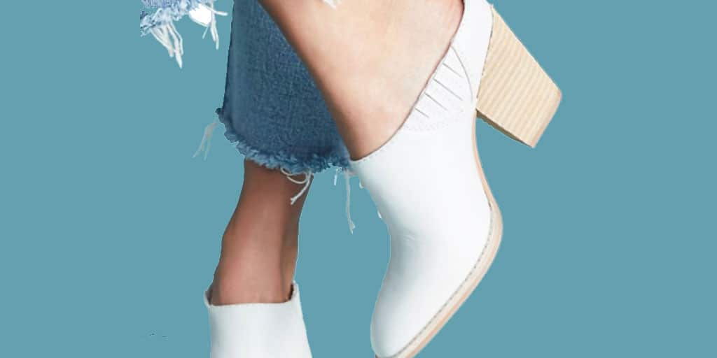 White mules with fringed hem jeans