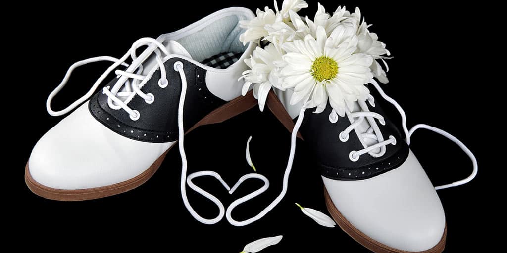 Pair of saddle shoes with a daisy